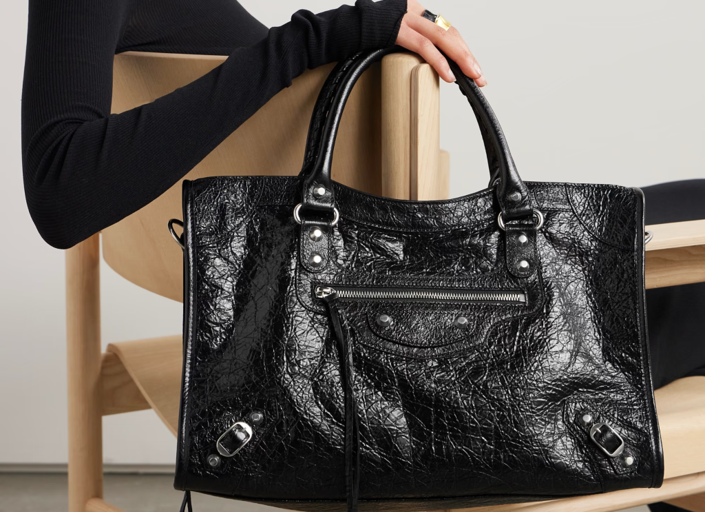 A stylish and trendy quilted leather tote bag from the 2024 collection, featuring gold-tone hardware and spacious compartments, perfect for elevating any outfit.