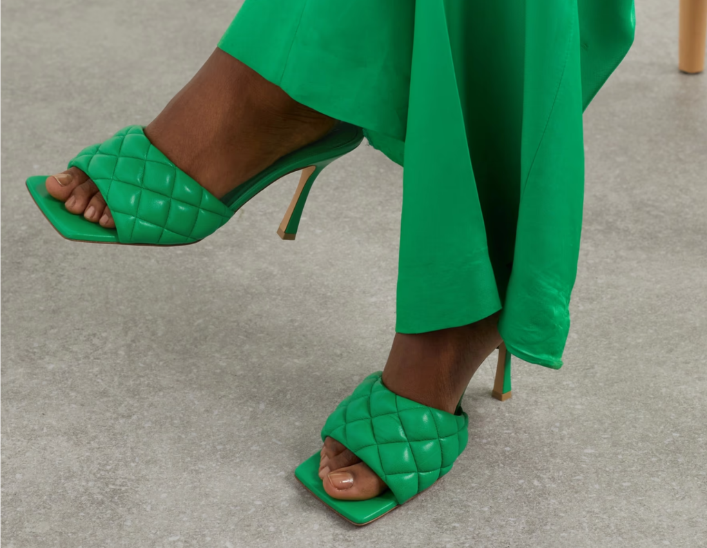 Stylish lime green neon heels with an ankle strap and block heel, offering a comfortable yet eye-catching option for summer outings and parties.